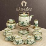 Bộ ấm chén màu ngà quai đồng dáng bầu họa tiết Trúc Xanh SG-AC141